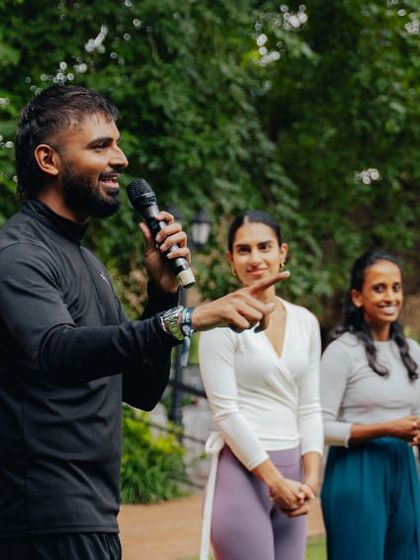 An organizer speaks to the attendees at the Founders Peak retreat, showcasing our ability to host professional presentations outdoors.
