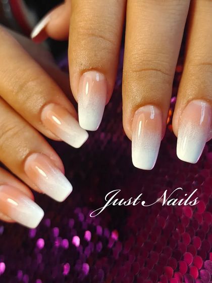 A classic pink and white ombre on coffin-shaped nails, a timeless and popular choice.