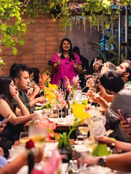 The host of our wine tasting event addressing the guests, sharing her expertise and passion for wine.