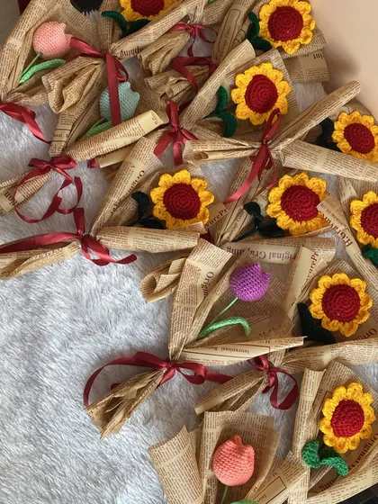 Another view of the bulk order for Teacher's Day, with a mix of single sunflowers and tulips ready to be gifted.
