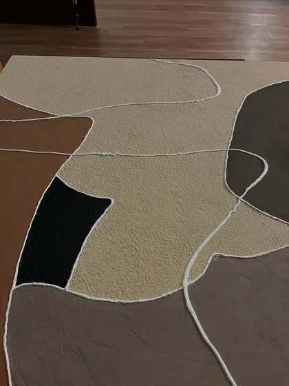 A top-down view of the textured canvas, showing the raised lines and rough surfaces.