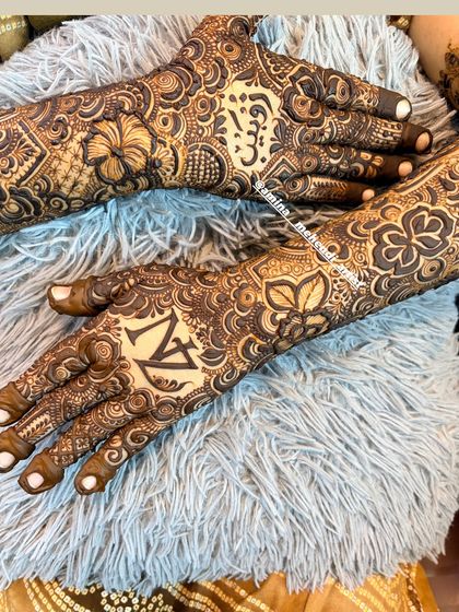 A beautiful shot of the 'N' and 'Z' initials, surrounded by intricate floral and paisley details.