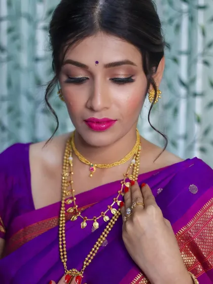 A close-up of the makeup, showing the blended eyeshadow and the perfect shade of pink lipstick that brightens her entire face.