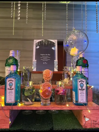A rustic yet chic 'Do-It-Yourself' Gin Bar setup. We provide premium gins like Bombay Sapphire, along with a variety of botanicals, dehydrated fruits, and tonics for guests to create their own perfect G&T.