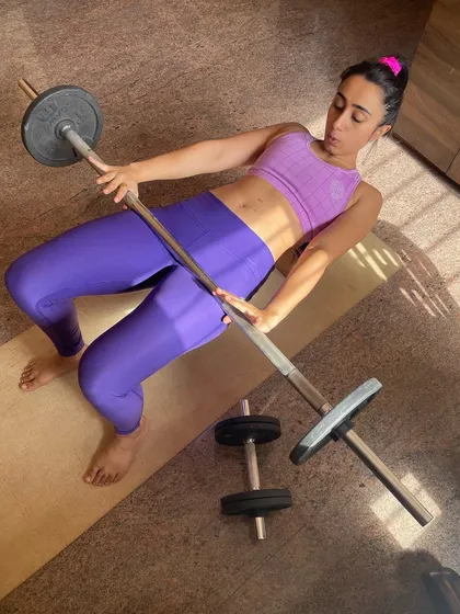 An overhead view of my home workout setup for hip thrusts. I can teach you how to use basic equipment to achieve your strength goals.