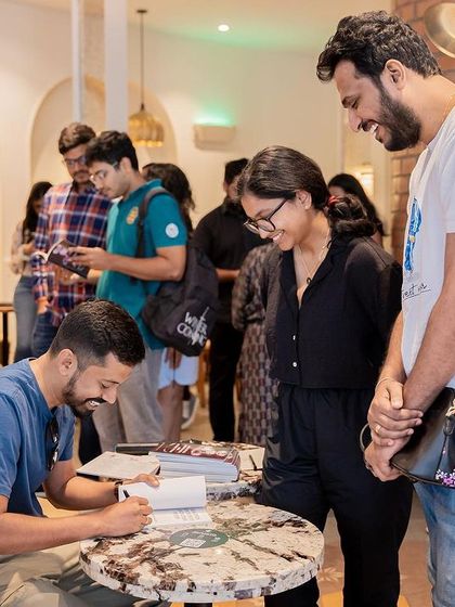 Readers patiently queue to meet author Prakash Raghupati and get their copies of his poetry collection signed.