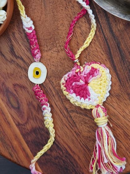 A combo set of a 'Bro' rakhi and a matching Lumba. Perfect for celebrating the bond with your brother and bhabhi.