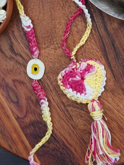 A combo set of a 'Bro' rakhi and a matching Lumba. Perfect for celebrating the bond with your brother and bhabhi.