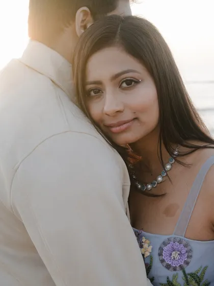 A look of pure trust and comfort. This intimate close-up by the sea captures the feeling of finding your safe harbor in another person.