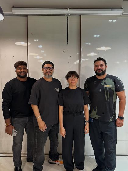 Our trainers posing with a guest artist, highlighting our connection to the wider industry and our commitment to bringing in expert educators.