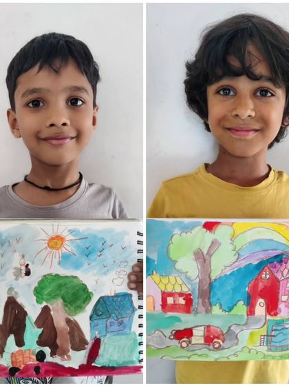 Two boys display their landscape drawings, each a unique world. One created a scene with mountains, a house, and butterflies, while the other imagined a vibrant red house with a rainbow overhead.