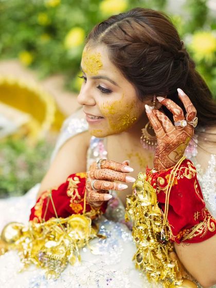A duplicate of the close-up of the bride, showing her beautiful henna and the details of her Haldi look.