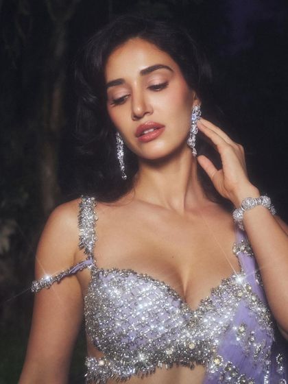 A close-up that captures the intricate details of the blouse and jewelry. I kept the makeup elegant and understated to let the outfit's sparkle take center stage.