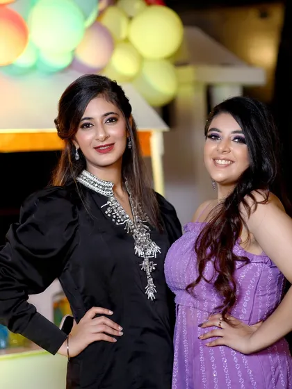 A bright and happy portrait of two friends at a celebration. My goal is to provide guests with professional-quality photos they'll be excited to share.