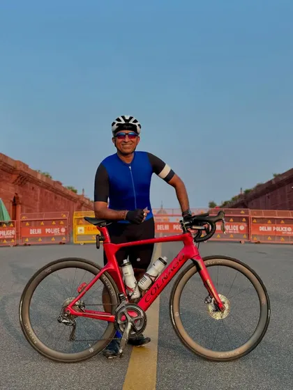 Posing with the Colnago in front of the red sandstone walls of the Secretariat Building.