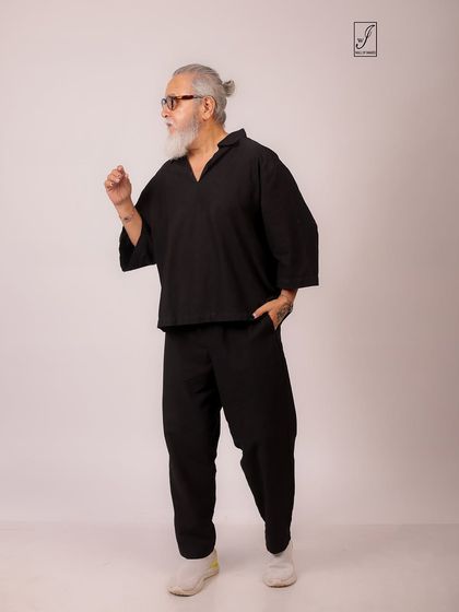 A dynamic pose that captures movement and energy, showing the versatility of the model and the clothing.