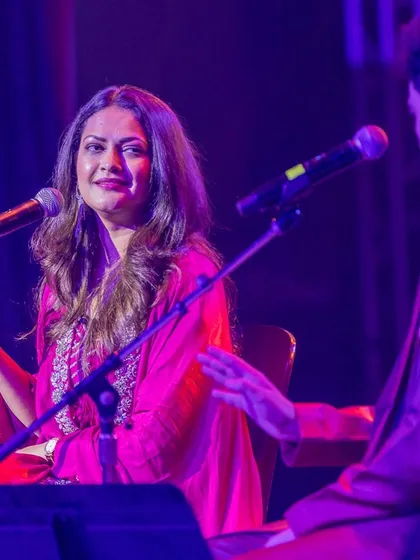 An interactive moment on stage with a fellow musician.