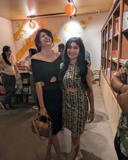 Sharing a laugh with an attendee at the Atta Galatta poetry night, a space that brings hearts to throats.