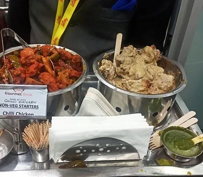 A serving tray featuring two of my popular non-vegetarian starters: spicy Chilli Chicken and creamy, mild Chicken Malai Tikka, showcasing a range of flavors.