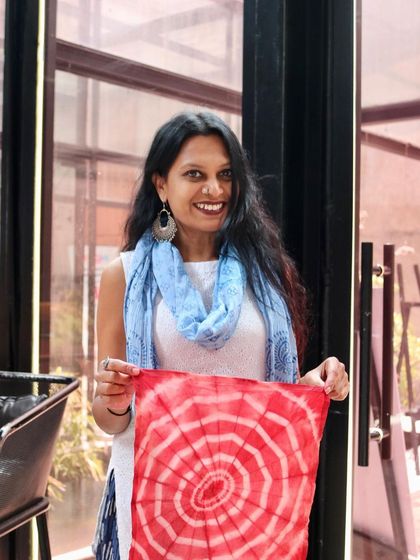 Another happy creator with her unique tie-dyed napkin. The web-like pattern she created is absolutely beautiful and one-of-a-kind.
