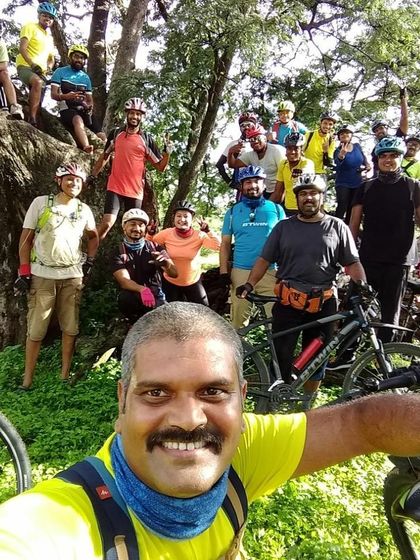 A classic ride leader selfie, capturing the entire happy crew in the background.