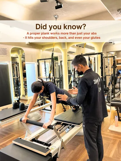 Form is everything. Our hands on approach ensures you perform each movement safely and effectively, like perfecting this plank on the Reformer to engage the entire core.