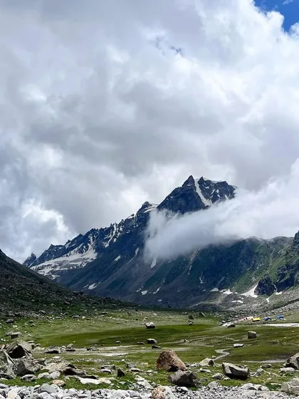 The dramatic, cloud-covered peaks of the Pir Panjal range, as seen on the Hampta Pass trek.