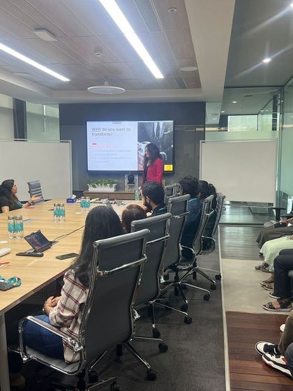 A wide angle of a boardroom training session. This view shows the typical setup for my small-group corporate workshops, which are designed for deep engagement and personalized feedback.