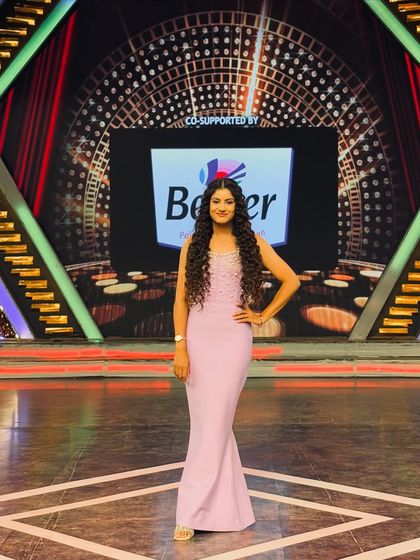 Another look at the full outfit on the television set. I can provide guidance on costumes and styling for your event to ensure performers look their best.