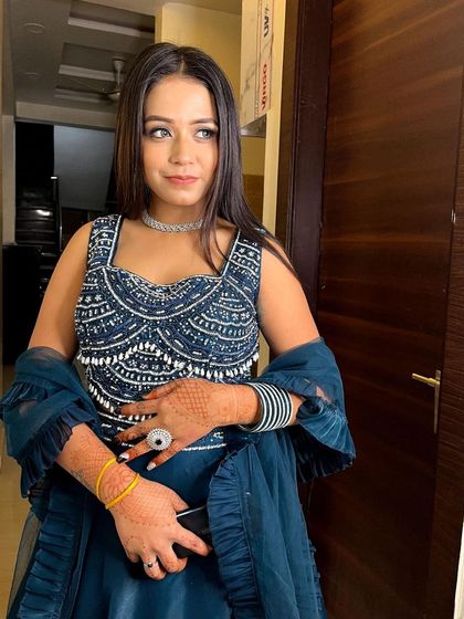 A candid shot of a client enjoying her event in a stylish and comfortable rental lehenga. My goal is to make you feel your best.