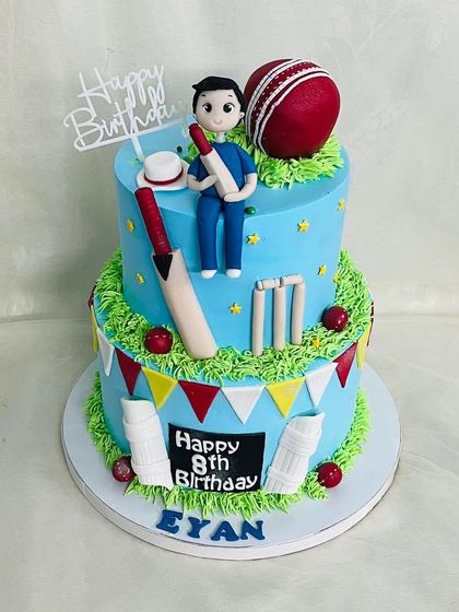 Another view of the detailed two-tier cricket cake.