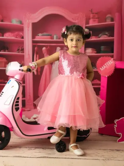 This little Barbie fan is ready to ride, posing with a pink scooter in my custom-designed dream closet set. It's all about capturing playful and imaginative moments.