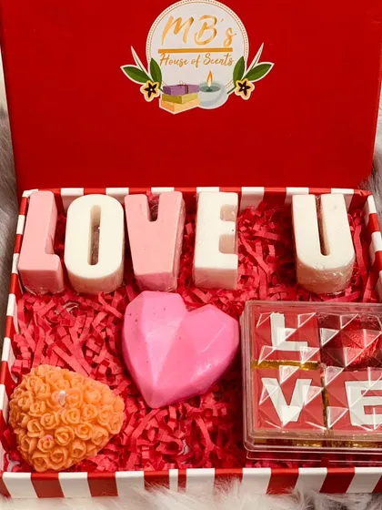 My 'Love Box' is curated to express affection on Valentine's Day. It includes 'LOVE U' soap bars, a heart-shaped soap, a rose-embedded candle, and edible chocolates, making it a complete and heartfelt gift for your special someone.