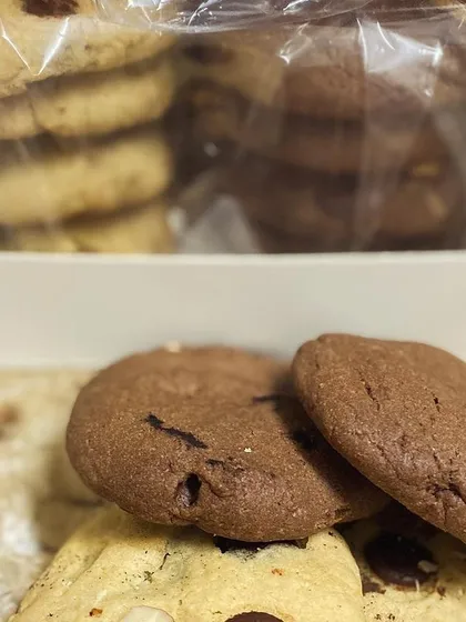 A close-up of our cookie assortment, with the clear gift box showing the stacks of cookies inside.