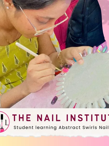 A student practices creating abstract swirls, learning how to blend colors and create fluid, eye-catching patterns.