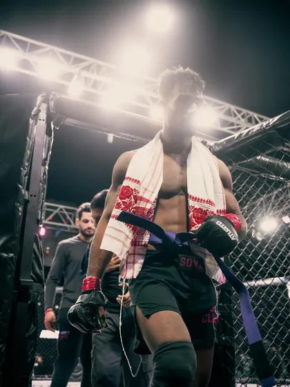 The walk to the cage. A warrior ready for battle, carrying the legacy of his training and the spirit of his team.