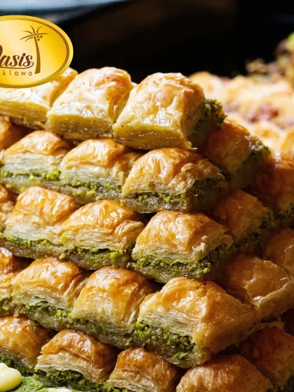 A mountain of our classic pistachio baklava. Each piece is a perfect square of flaky phyllo pastry, packed with premium nuts and sweetened with honey, not sugar.