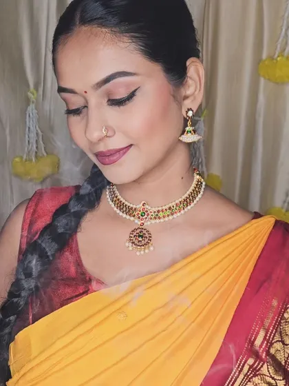 A festive look for a Diwali-themed photoshoot. The makeup is traditional and glamorous, with a focus on bold eyes and lips.
