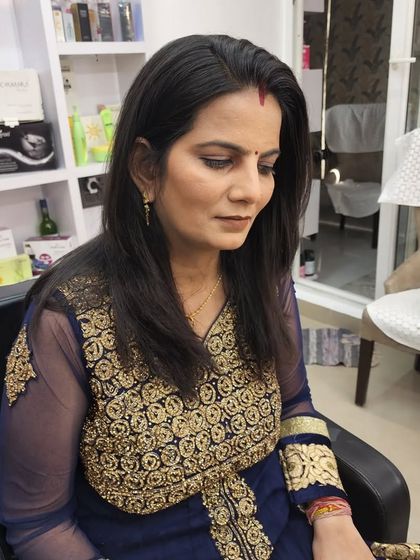 A client getting a simple and natural makeup look, perfect for a family member who wants to look polished but not overdone.