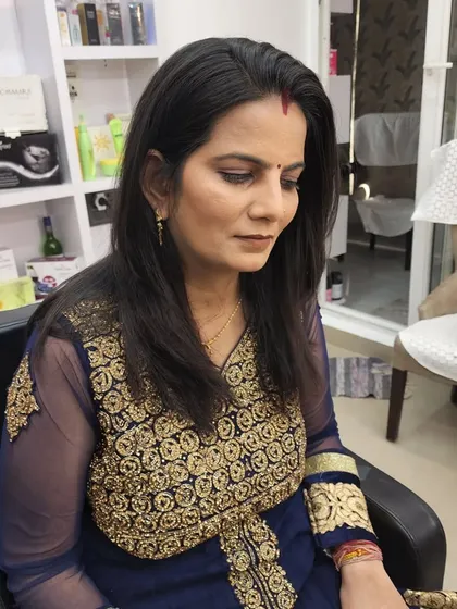 A client getting a simple and natural makeup look, perfect for a family member who wants to look polished but not overdone.
