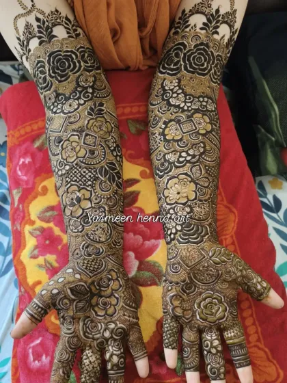 A beautiful example of a dense, full-arm bridal design where every inch is covered in art. The contrast between the dark and light shading gives it a wonderful texture.