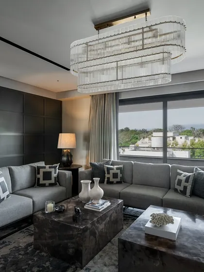 This living room is all about quiet elegance. A sophisticated color palette, modern furniture, and ample natural light combine to create a timeless and charming space for relaxation.