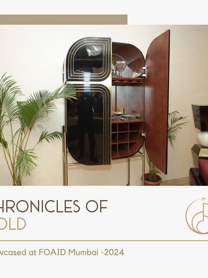 Our bespoke bar cabinet, featured in the "Chronicles of Gold" exhibition. This piece combines dark wood, black glass, and a sculptural form to create a functional work of art.