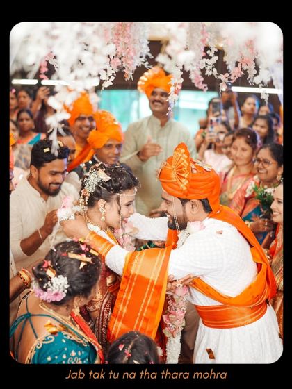 A candid moment of the groom embracing his bride during the ceremony, surrounded by loved ones. These unscripted displays of affection are the heart of my wedding photography.