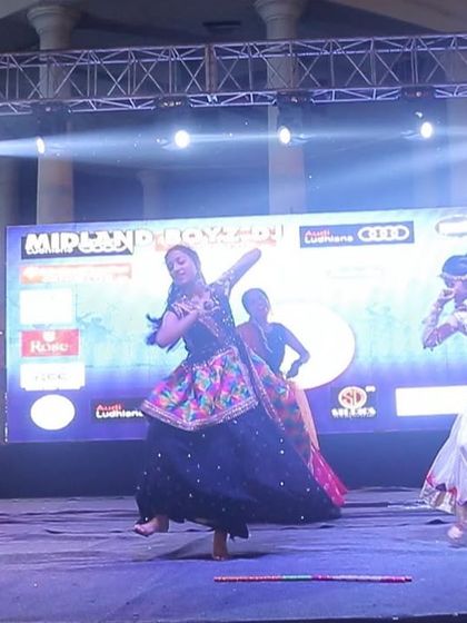 Our professional dancers performing a traditional Garba piece on stage. We showcase authentic folk dances with beautiful costumes and graceful movements.