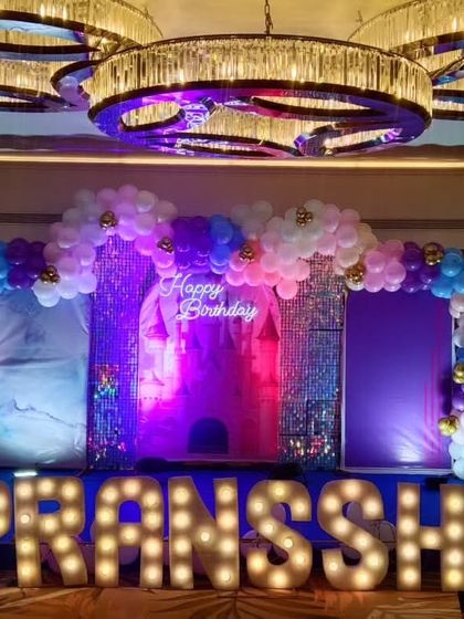 A different lighting effect on the princess castle stage, creating a magical purple and blue ambiance.