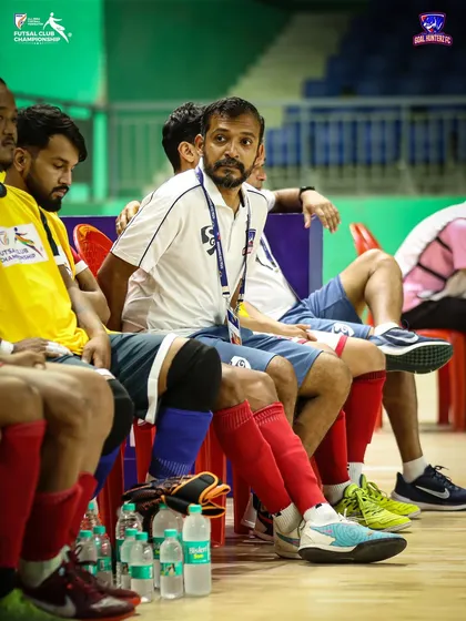 The focused gaze of our coach from the sidelines during the final, strategizing every move.