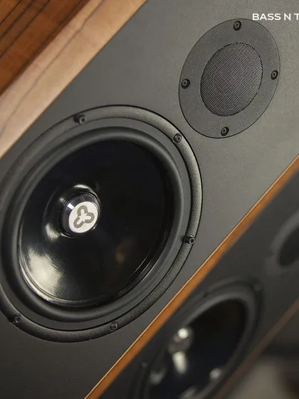 A close-up of the award-winning Kudos Titan 707 speaker. These speakers are renowned for their ability to deliver a live, in-the-room performance with incredible realism.