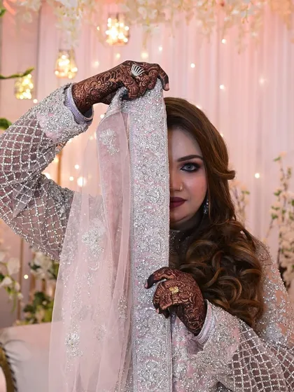 A playful peek-a-boo with the dupatta.
