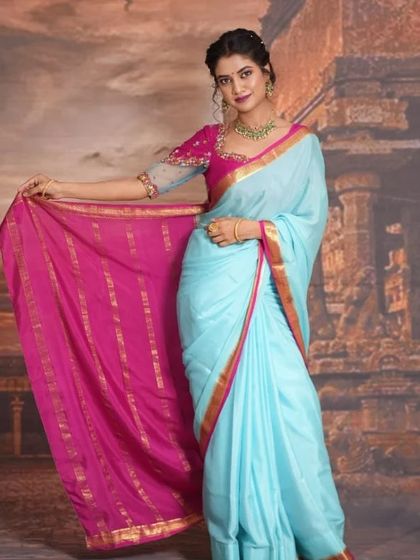 A lovely series of a model in a light blue and pink saree, wearing our simple green bead choker. This is a perfect look for a bridesmaid or a guest at a wedding.